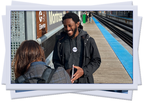 Mike talks with a voter on the subway platform